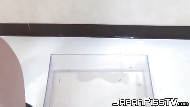 Hot Japanese cutie urinating in pink panties